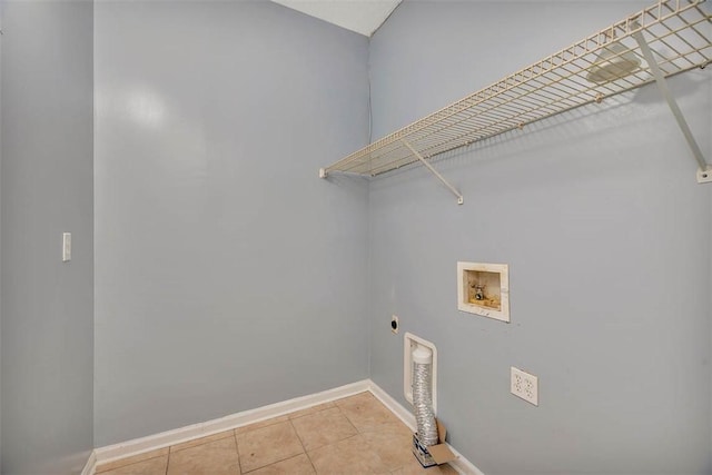 washroom featuring baseboards, light tile patterned floors, hookup for a washing machine, laundry area, and electric dryer hookup