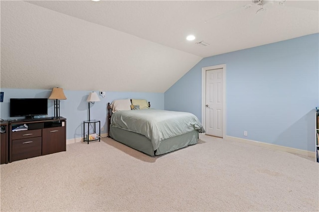 bedroom with carpet, lofted ceiling, and baseboards