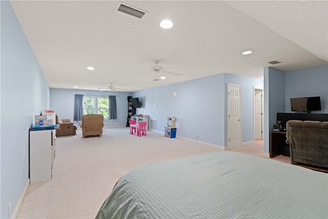 bedroom featuring light colored carpet, recessed lighting, baseboards, and a ceiling fan