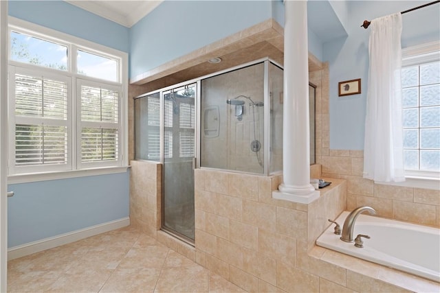 full bath featuring a shower stall, tile patterned floors, a bath, and decorative columns