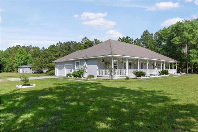 view of front of home featuring a porch, a garage, and a front lawn