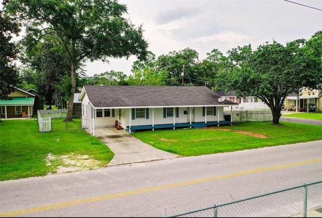 315 Magnolia St, Waycross, GA 31501 - view of front of house featuring a front yard, concrete driveway, a porch, and fence