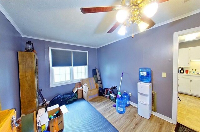 315 Magnolia St, Waycross, GA 31501 - workout room featuring wood finished floors, crown molding, baseboards, and ceiling fan