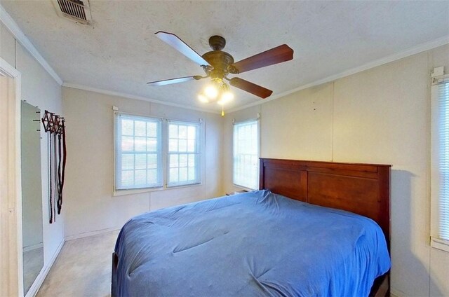 315 Magnolia St, Waycross, GA 31501 - bedroom with ceiling fan, crown molding, and light carpet