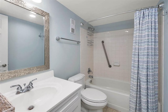 full bathroom featuring tile patterned flooring, vanity, shower / bath combo, and toilet