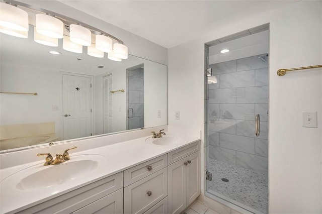 bathroom featuring vanity and an enclosed shower