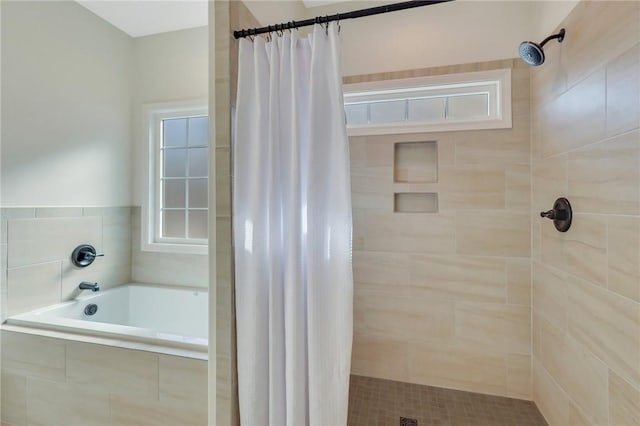 bathroom with a shower with curtain and a wealth of natural light