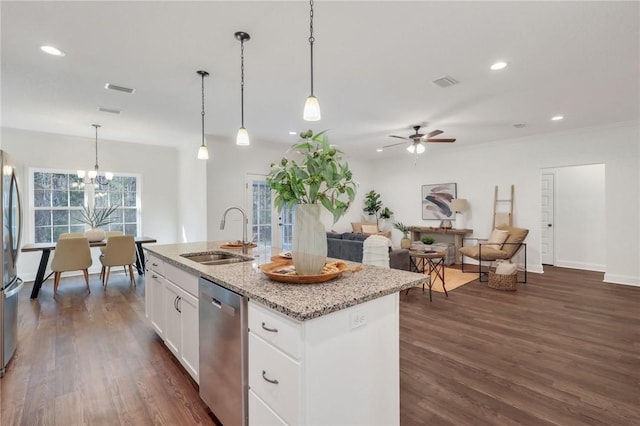 kitchen with sink, hanging light fixtures, stainless steel appliances, a kitchen island with sink, and white cabinets