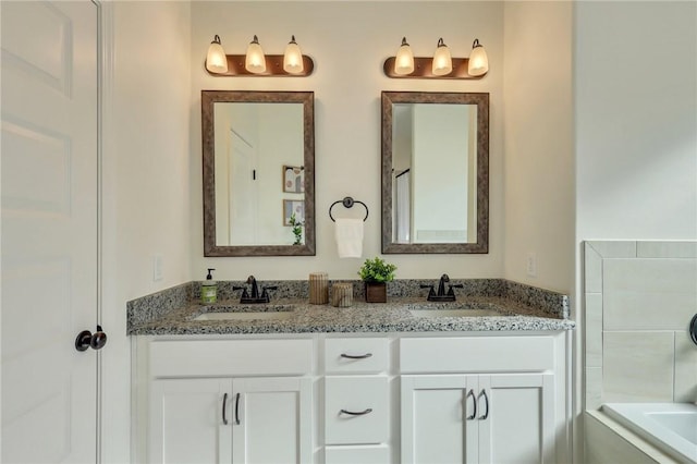 bathroom featuring vanity and a bathing tub