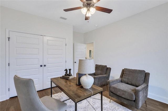 office space with dark hardwood / wood-style flooring and ceiling fan