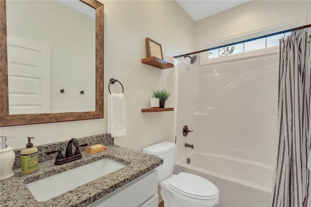 full bathroom with vanity, shower / bathtub combination with curtain, and toilet