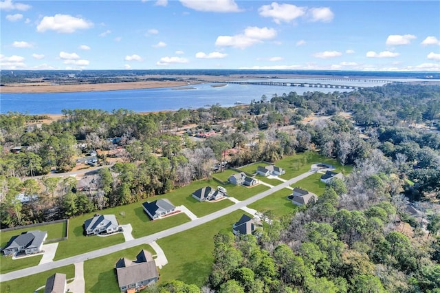 drone / aerial view with a water view