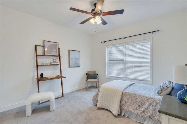 bedroom with light carpet and ceiling fan