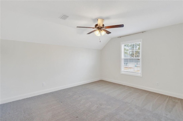 additional living space with lofted ceiling, carpet floors, and ceiling fan