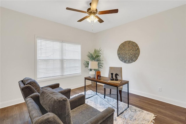 office space featuring dark hardwood / wood-style flooring and ceiling fan