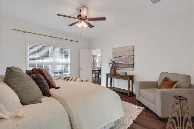 bedroom with dark wood-type flooring and ceiling fan