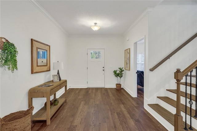 foyer entrance with crown molding and dark hardwood / wood-style floors