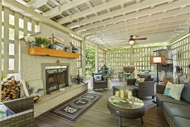 219 Abbott Ln, Saint Simons Island, GA 31522 - sunroom with an outdoor living space with a fireplace, a ceiling fan, and plenty of natural light
