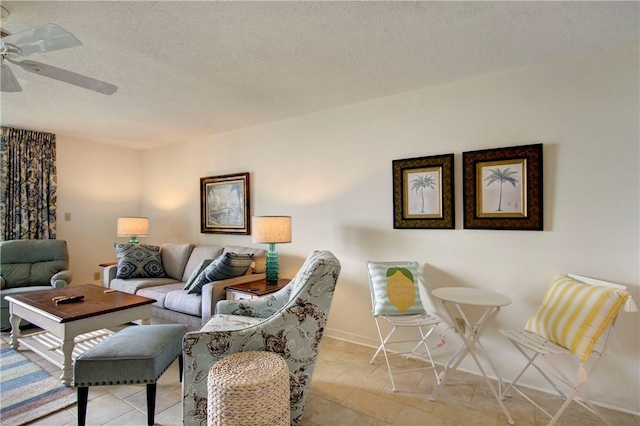 living room featuring light tile patterned floors, a textured ceiling, and ceiling fan