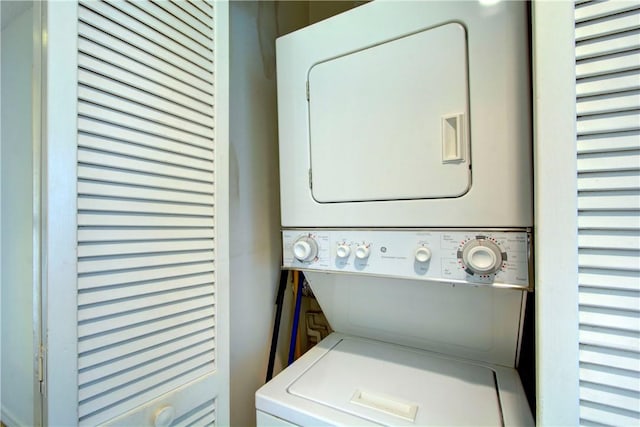 washroom with stacked washer / dryer