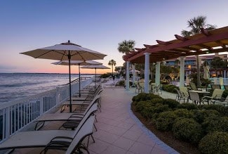 view of home's community with a water view and a pergola