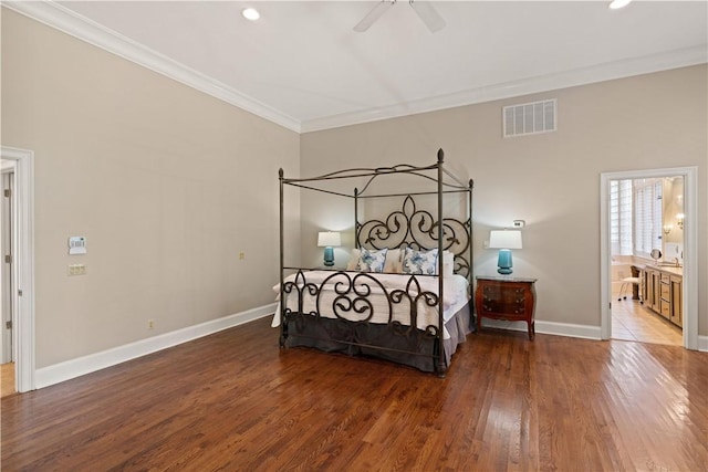 bedroom with ceiling fan, ornamental molding, ensuite bathroom, and wood-type flooring