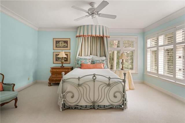 bedroom featuring light colored carpet, ceiling fan, and ornamental molding