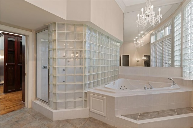 bathroom with tile patterned floors, crown molding, and plus walk in shower