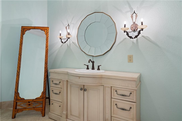 bathroom with tile patterned flooring and vanity