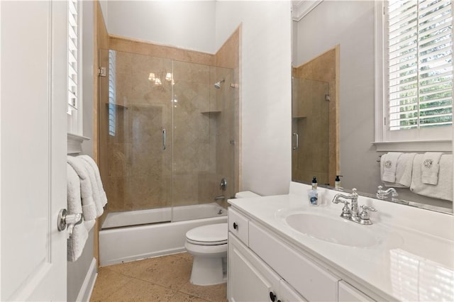 full bathroom with vanity, toilet, and shower / bath combination with glass door