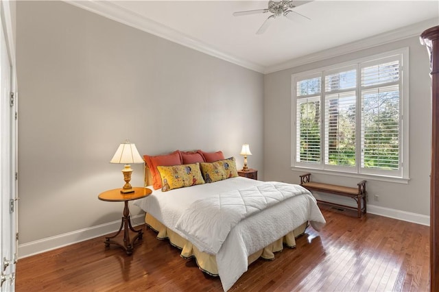 bedroom with hardwood / wood-style flooring, ceiling fan, and crown molding