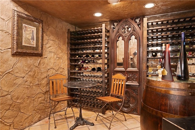 wine room with tile patterned floors