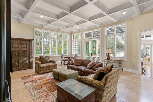 sunroom with beamed ceiling, french doors, and a healthy amount of sunlight