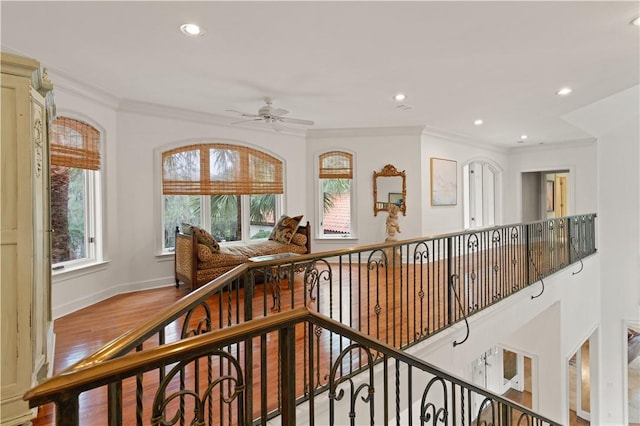 hall featuring crown molding and hardwood / wood-style floors