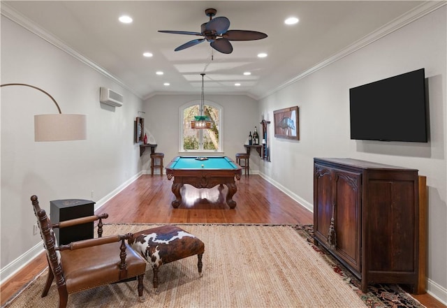 recreation room with ceiling fan, lofted ceiling, ornamental molding, and light hardwood / wood-style flooring