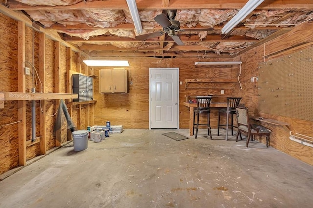 miscellaneous room featuring ceiling fan and concrete floors