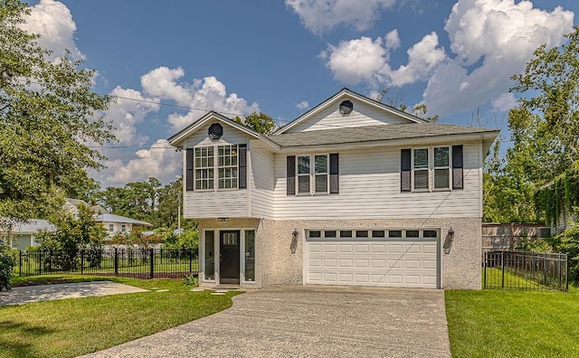 view of front property featuring a front yard and a garage