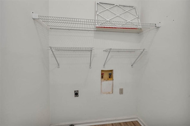 laundry area featuring hookup for an electric dryer, wood-type flooring, and hookup for a washing machine