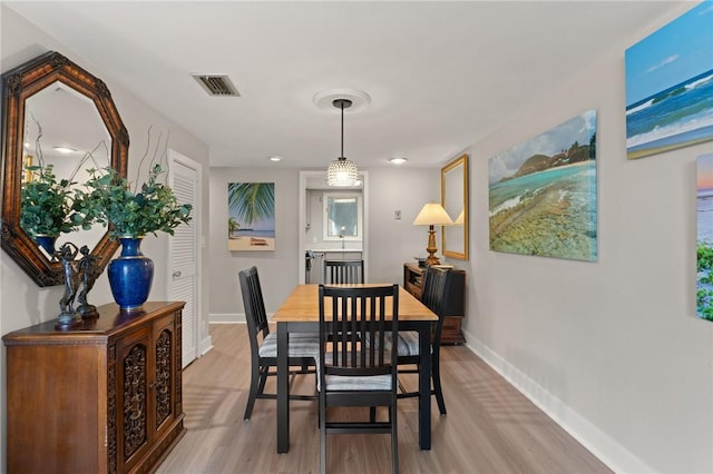 669 N Golf Villas, Saint Simons Island, GA 31522 - dining area featuring baseboards and light wood-style floors