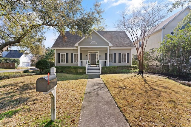 view of front of house featuring a garage and a front yard