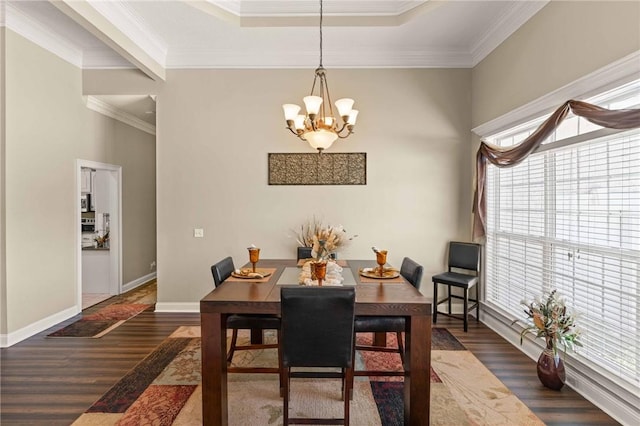 106 Hickory Pne, Brunswick, GA 31523 - dining area featuring a chandelier, dark wood-style flooring, crown molding, and baseboards