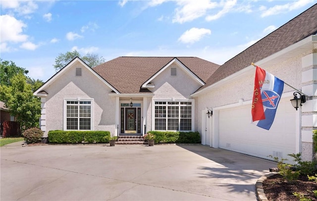 106 Hickory Pne, Brunswick, GA 31523 - view of front of property featuring concrete driveway, a garage, roof with shingles, and stucco siding