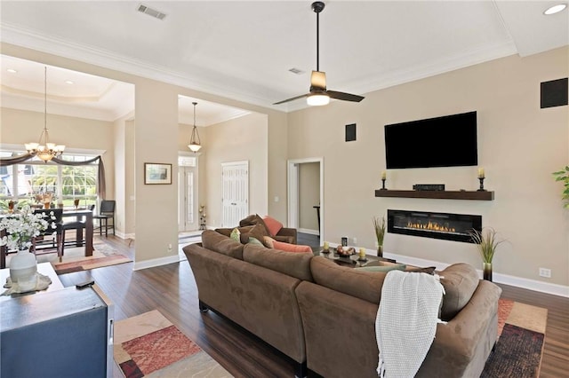106 Hickory Pne, Brunswick, GA 31523 - living room with a glass covered fireplace, dark wood finished floors, a ceiling fan, ornamental molding, and baseboards