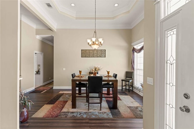 106 Hickory Pne, Brunswick, GA 31523 - dining room with wood finished floors, a chandelier, ornamental molding, baseboards, and a raised ceiling