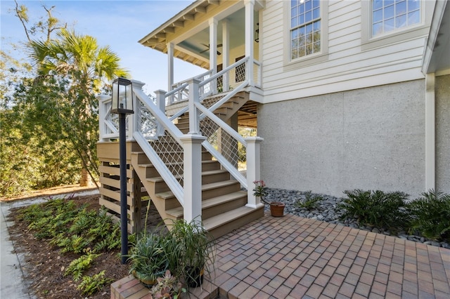 view of side of property featuring ceiling fan