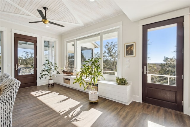 sunroom with wooden ceiling and ceiling fan