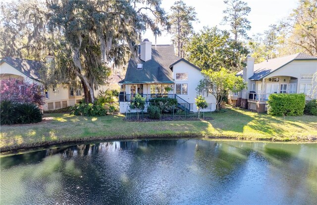 403 Indigo, Saint Simons Island, GA 31522 - rear view of house with a water view and a lawn