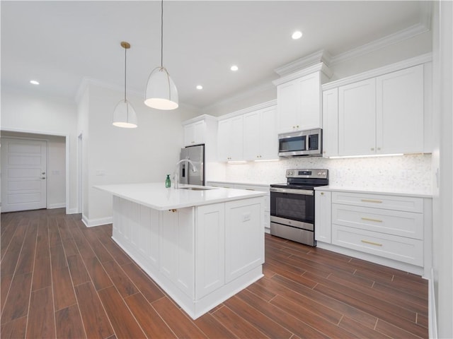 206 Placid Rd, Saint Marys, GA 31558 - kitchen featuring stainless steel appliances, tasteful backsplash, white cabinetry, crown molding, and recessed lighting