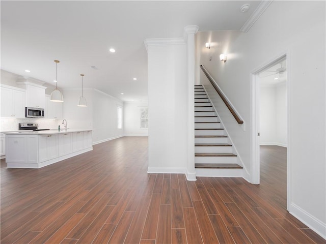 206 Placid Rd, Saint Marys, GA 31558 - stairway featuring wood finished floors, ornamental molding, and recessed lighting