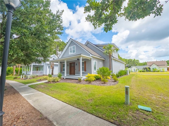 206 Placid Rd, Saint Marys, GA 31558 - view of front of property with a porch and a front lawn